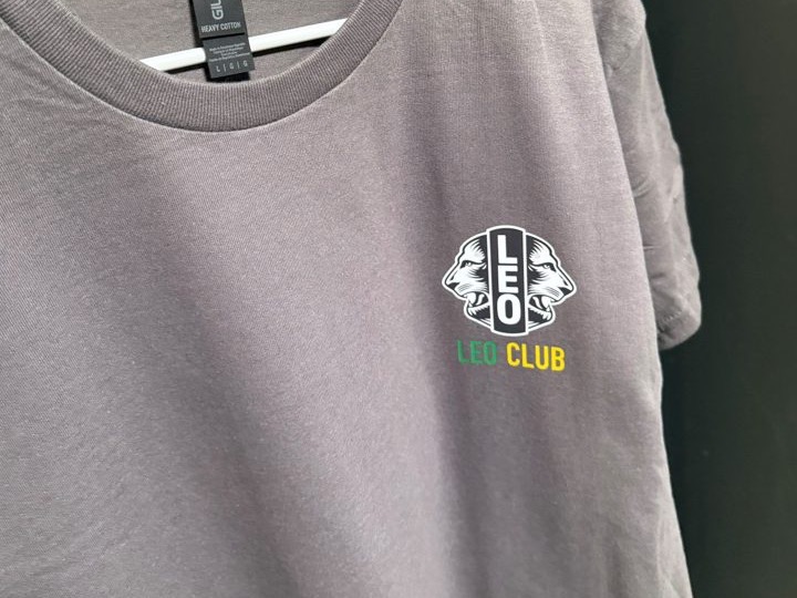A gray club t-shirt with a small logo on the chest, printed in our studio