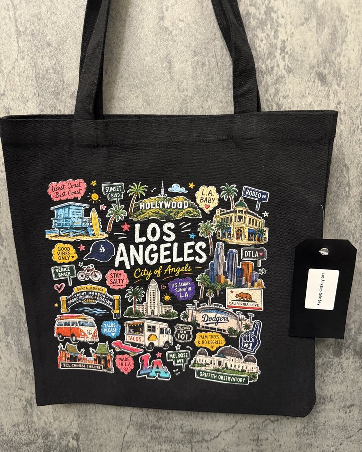 A black tote with a colorful Los Angeles illustration