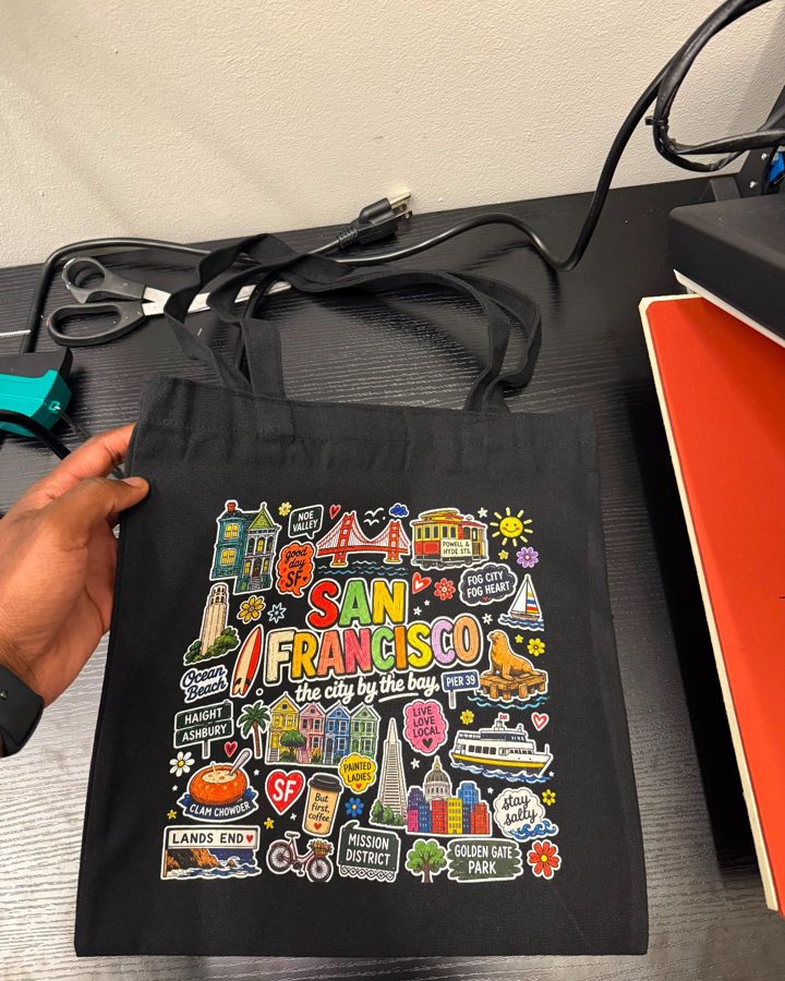 A black tote with a colorful San Francisco illustration