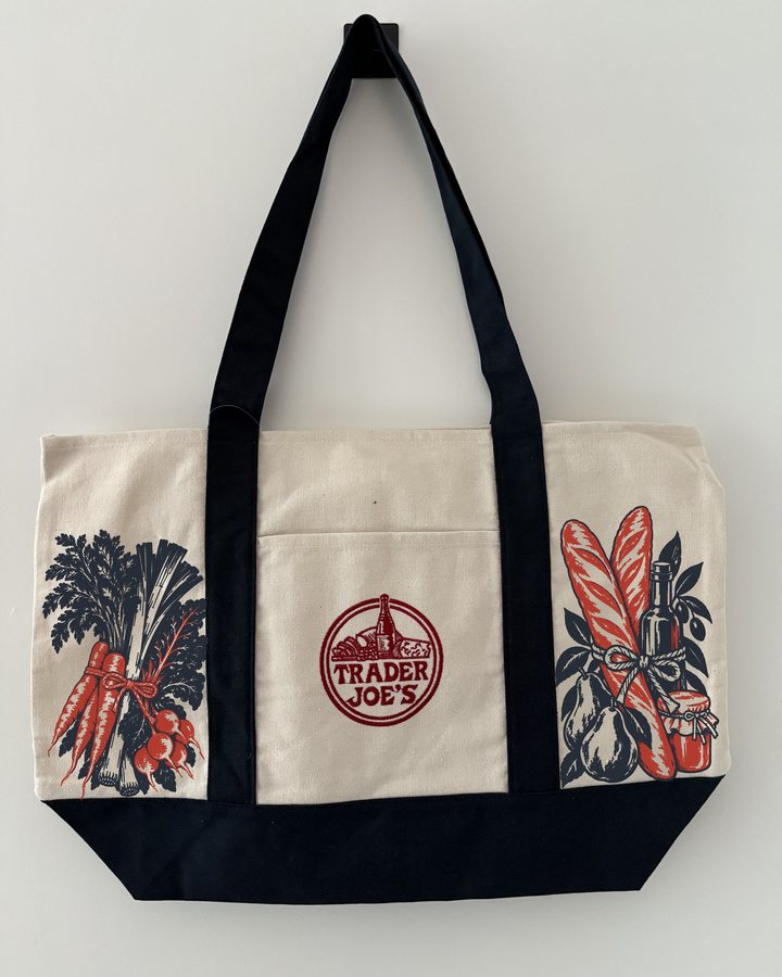 A Trader Joe’s canvas tote with our Market Day print of vegetables and bread